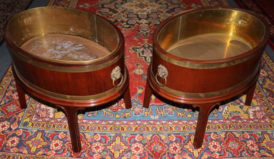 A pair of George III style mahogany brass banded wine coolers, W.72cm